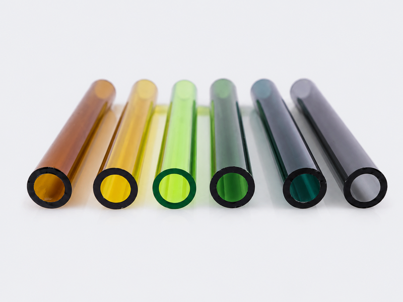 Colored glass tubes in amber green blue and gray