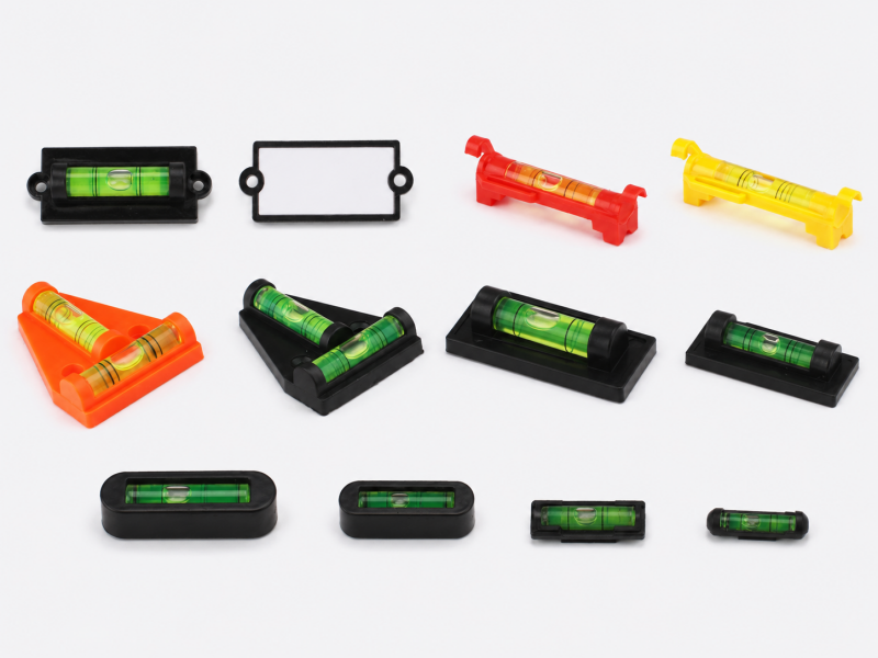 Tubular spirit level vials with plastic mounting bases
